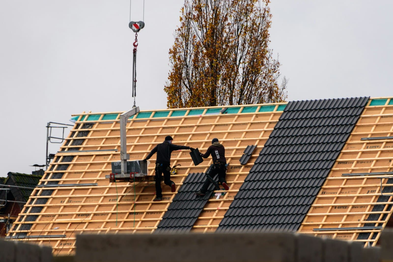 Roofing crew working on a residential roof